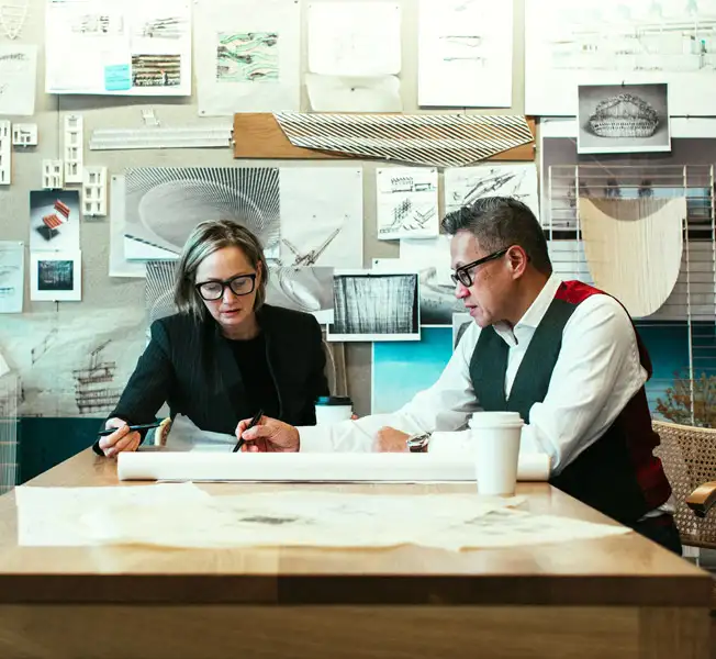 Gene and Sharron looking at drawings