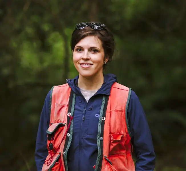 Malloree smiling in utility vest