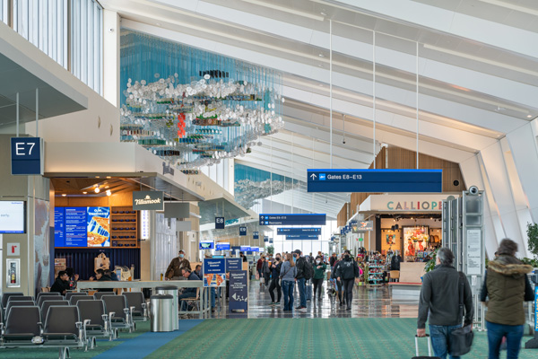 Wide view of Concourse E exterior at twilight