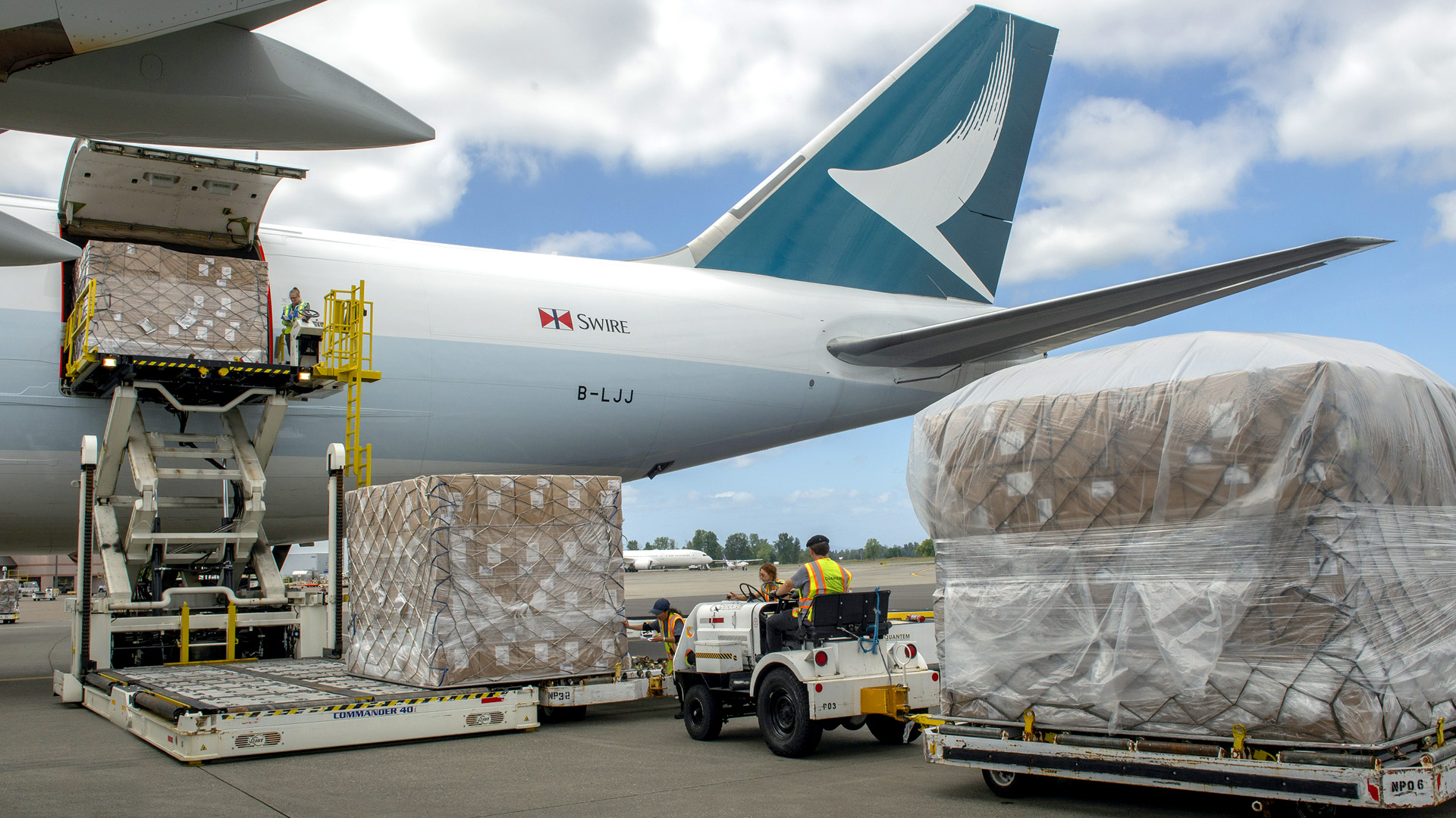 interior perspective of cargo plane with workers ready to accept load