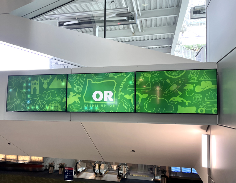 dynamic digital display above escalator