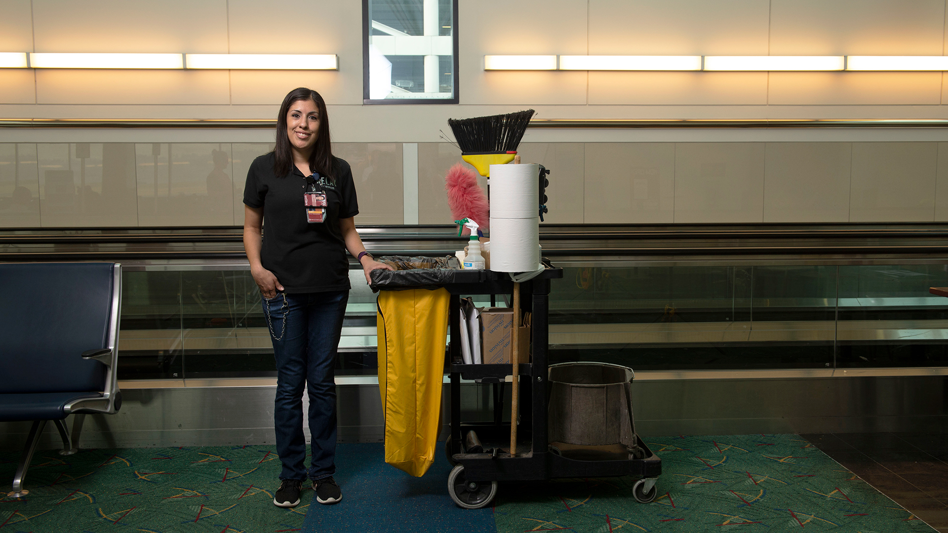 Relay employee with cleaning cart