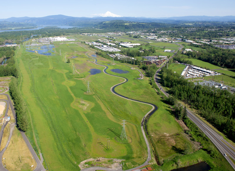 aerial of riparian area adjacent to business park with Mt. Hood in background