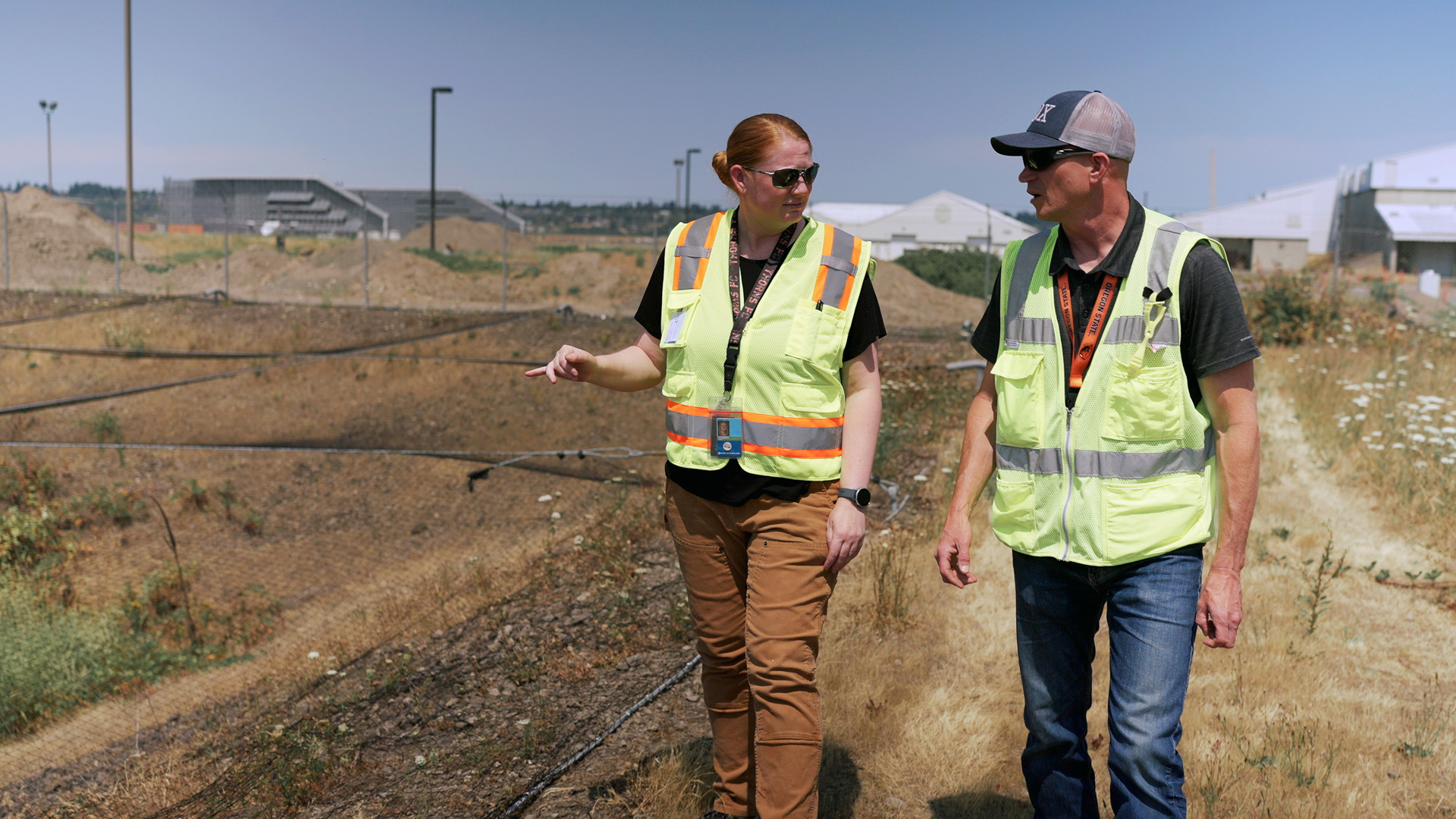 two employees walking in a stormwater management site
