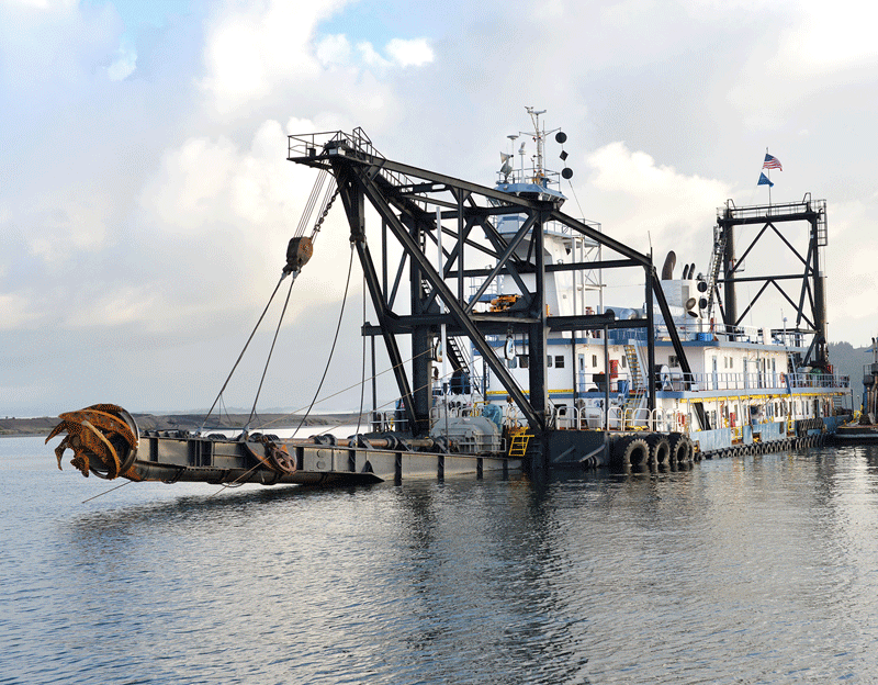 The Dredge Oregon with the cutter raised, then lowered, aerial of pipeline, pipe depositing dredge material
