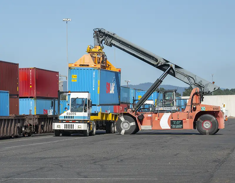 Aerial of Changjiu Logistics vessel unloading vehicles at Terminal 6