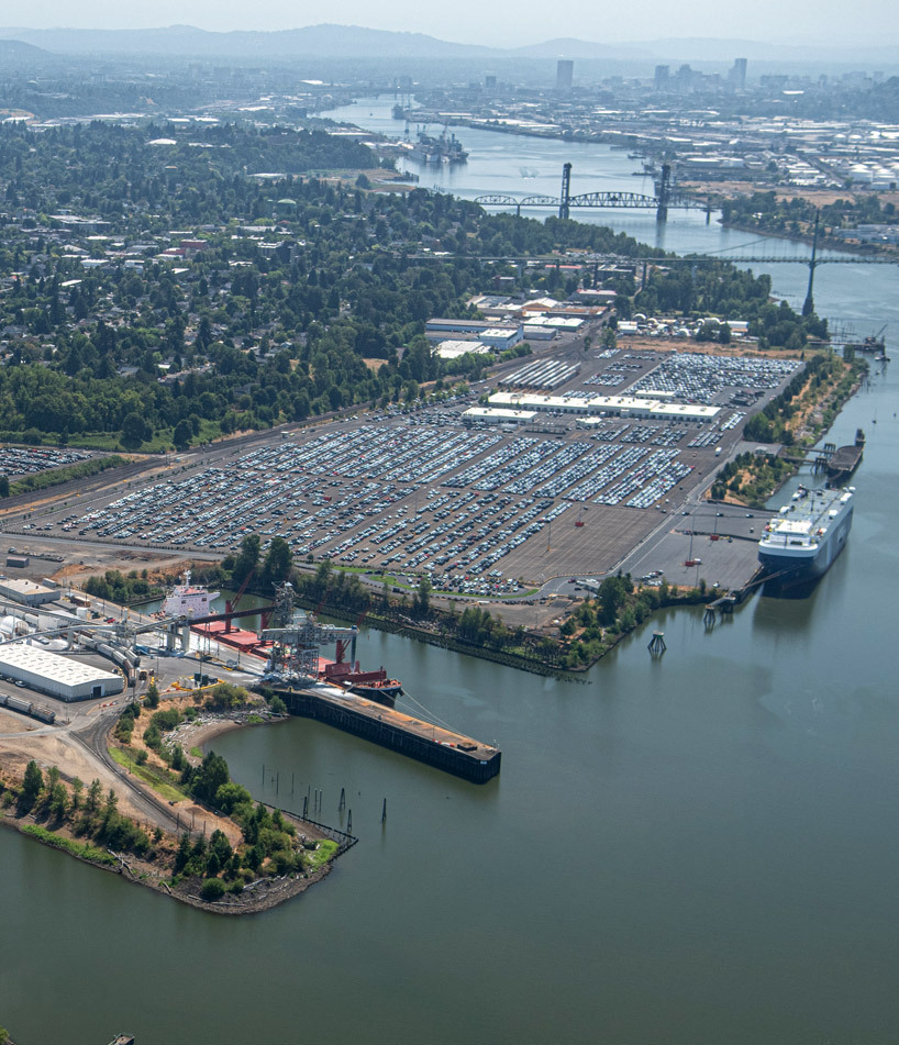 Aerial of Terminal 4 shows drybulk in foreground and Toyota vehicles in background
