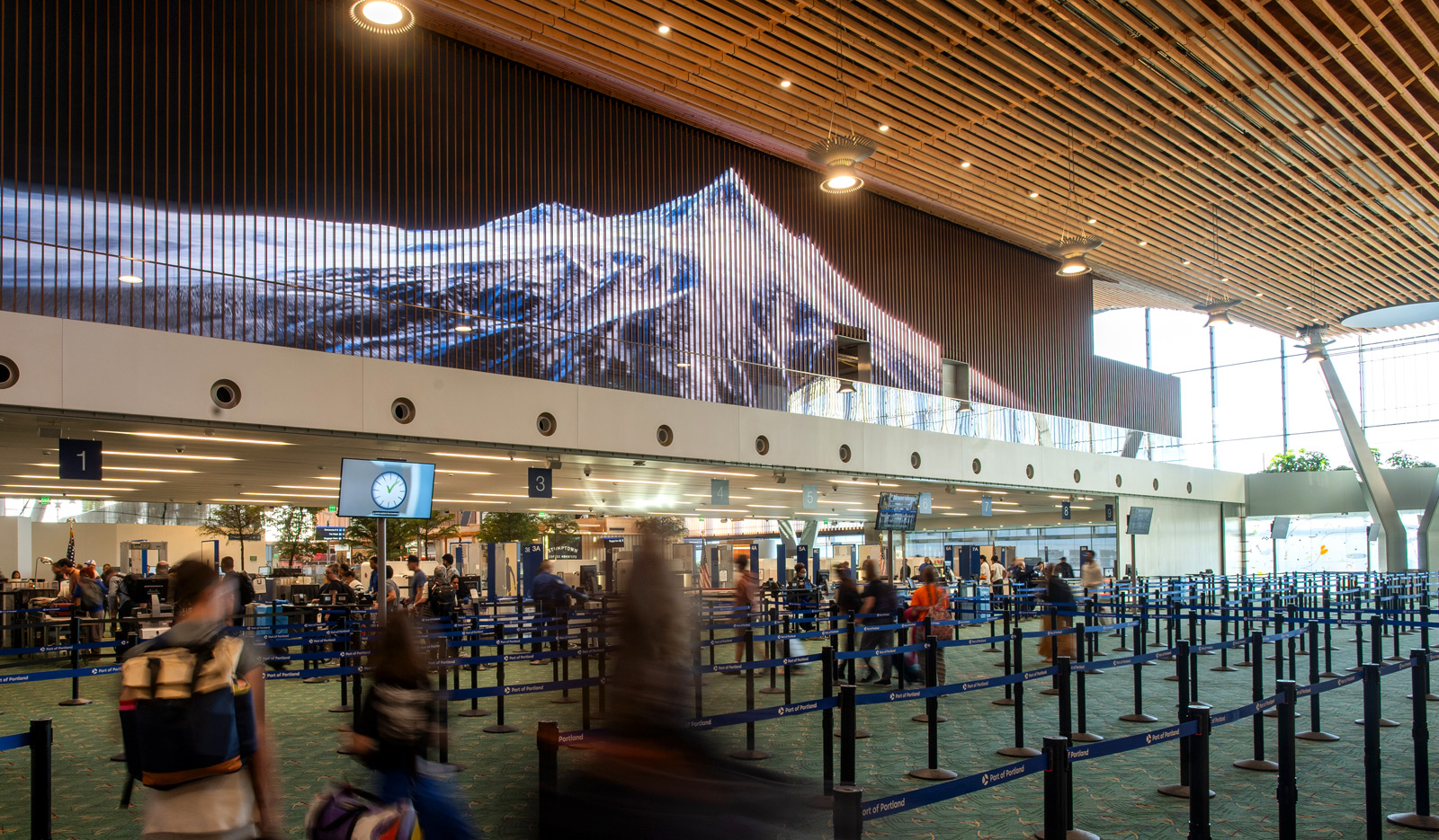 Footage of Terra Cascadia by Brad Johnson displayed on video walls at Portland International Airport