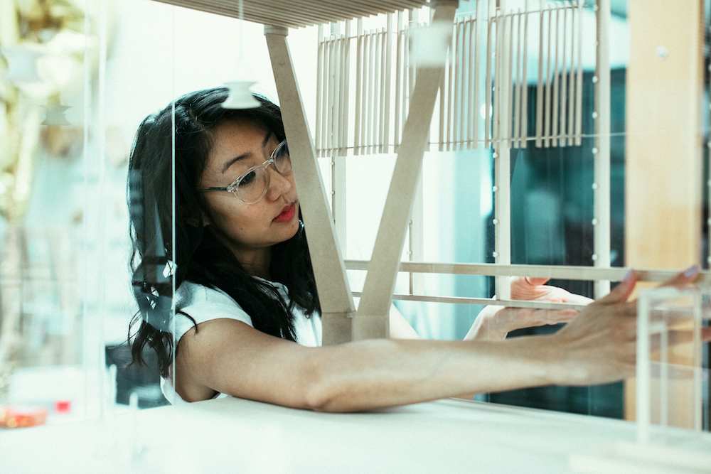 Talisa Shevavesh of architecture firm ZGF works in her studio on models of new airport designs