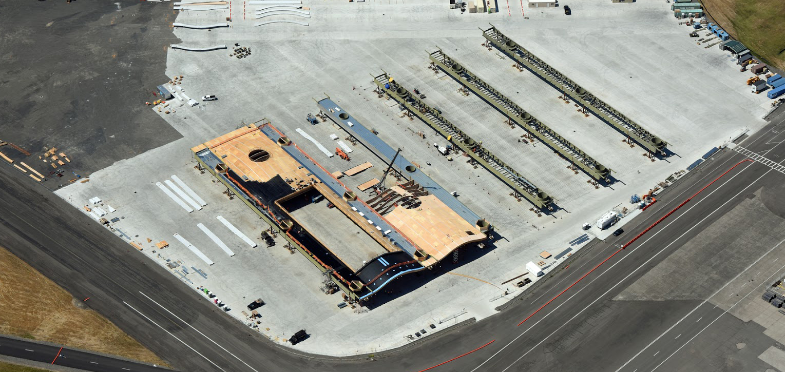 An aerial view shows the job site from above, where crews will work throughout 2021 on completing each segment of the new roof