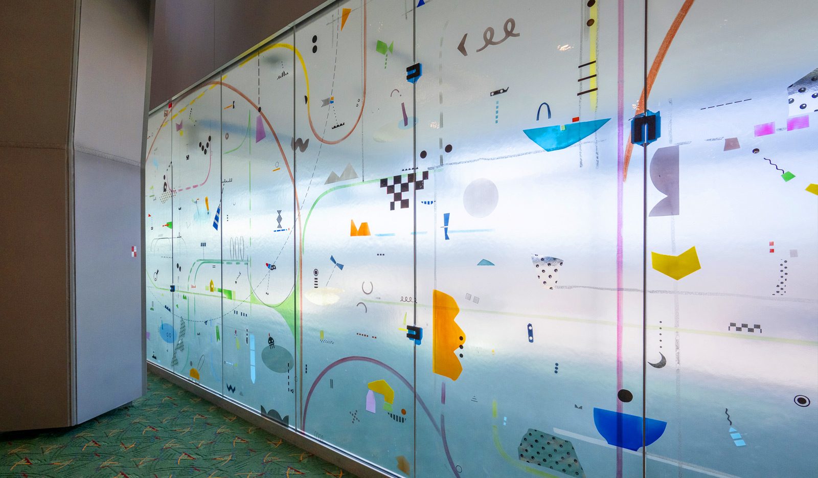 A section of the glass wall art named Between by artist Yoonhee Choi at Portland International Airport